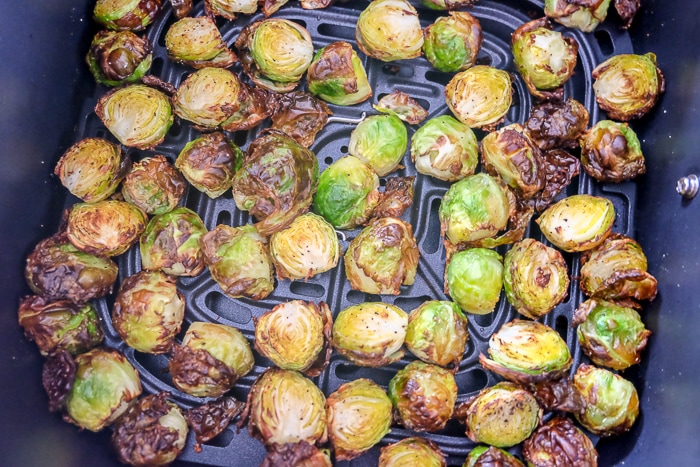 golden brown brussels sprouts in air fryer tray