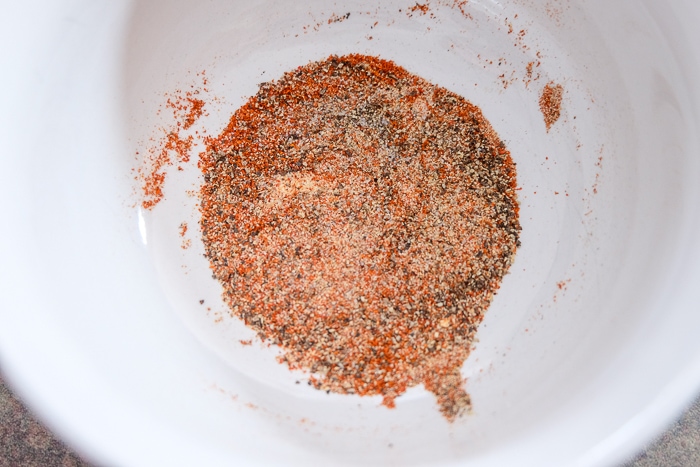 dry spices in white bowl on counter