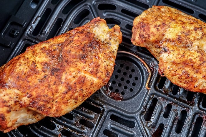 cooked chicken breast in air fryer tray