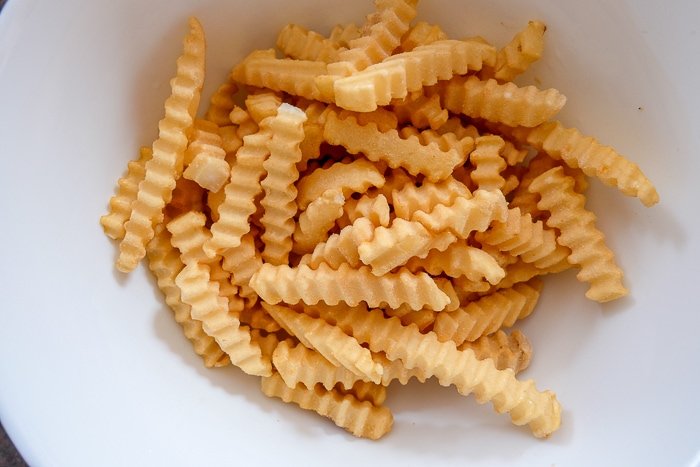 frozen french fries in white bowl on counter