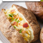 cooked baked potatoes with garnishes on white plate and text overlay 