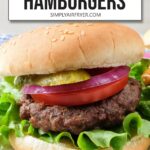cooked hamburger patty on bun with lettuce, onion and more plus text overlay "air fryer hamburgers".