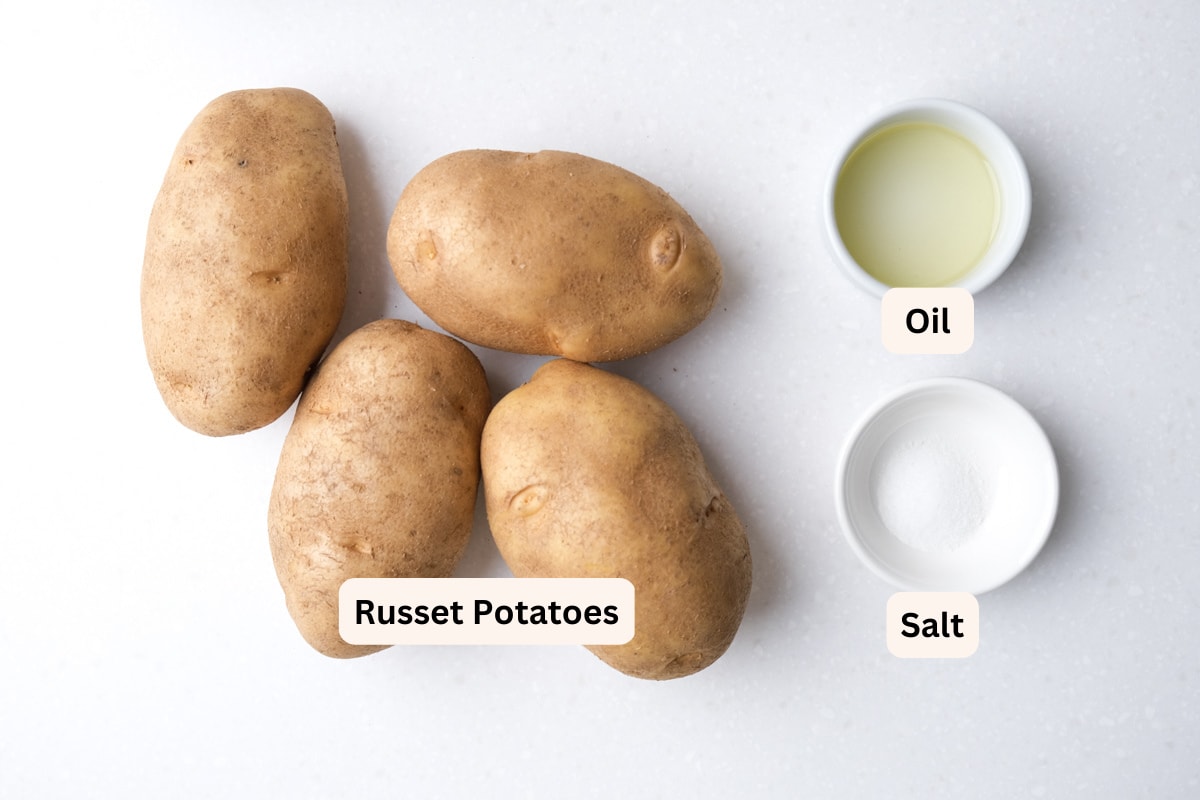 photo of potatoes salt and oil sitting on white counter with labels.