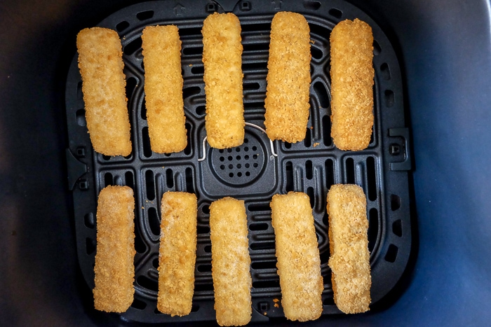 frozen stick sticks in black air fryer tray