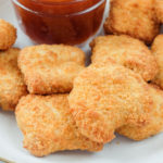 cooked chicken nuggets with dipping sauce in bowl