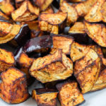 roasted eggplant in pieces in bowl on counter