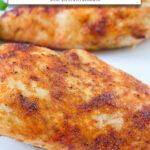 two cooked chicken breasts on plate with text overlay 