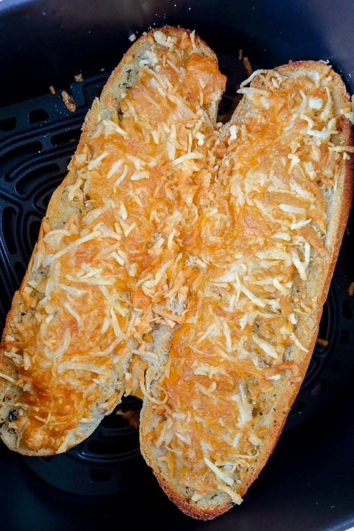 crispy garlic bread in black air fryer tray