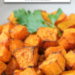 cooked butternut squash cubes in bowl with text overlay 