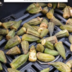 pieces of okra in black air fryer basket with text overlay 