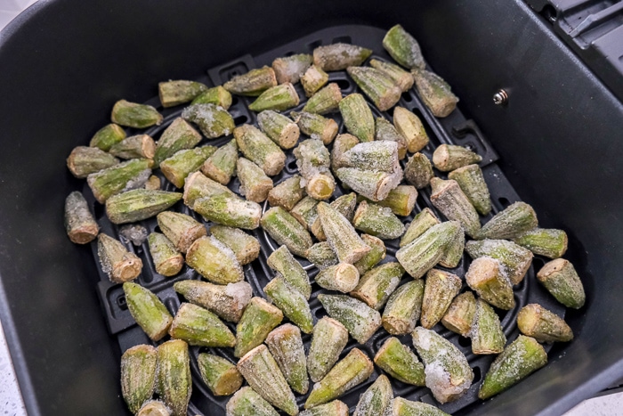 frozen okra in black air fryer tray