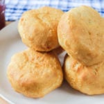 cooked biscuits on white plate on wooden board