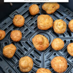 cooked battered mushrooms in black air fryer with text overlay "air fryer frozen battered mushrooms".