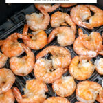 cooked shrimp in black air fryer with text overlay 