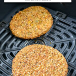 veggie burger patties in black air fryer with text overlay "frozen veggie burger in the air fryer".