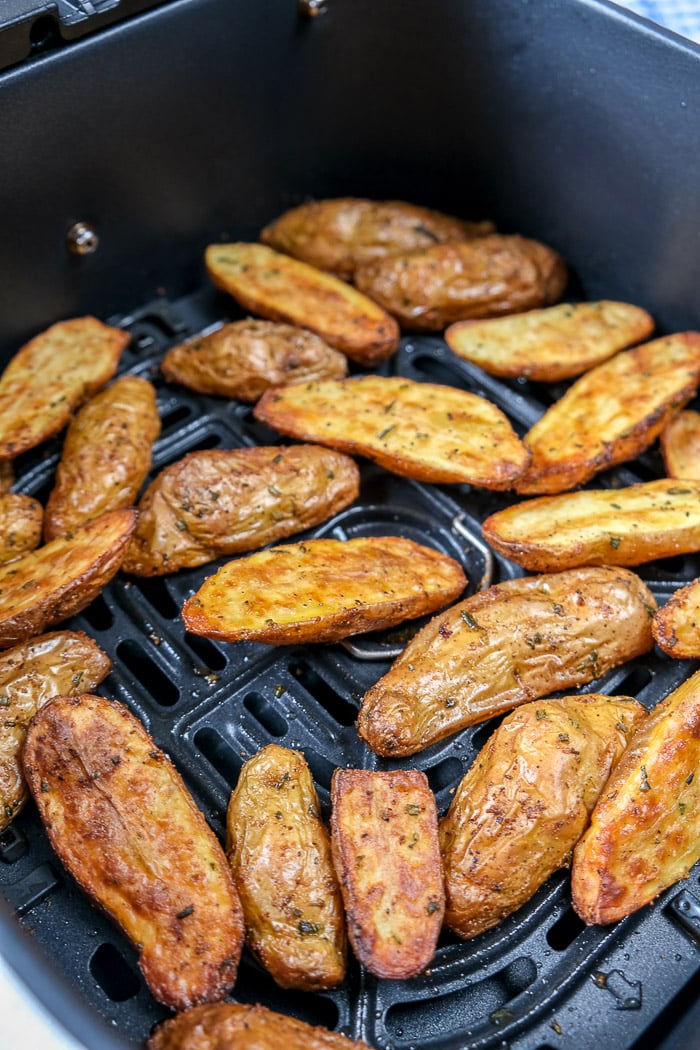 crispy fingerling potatoes in black air fryer tray