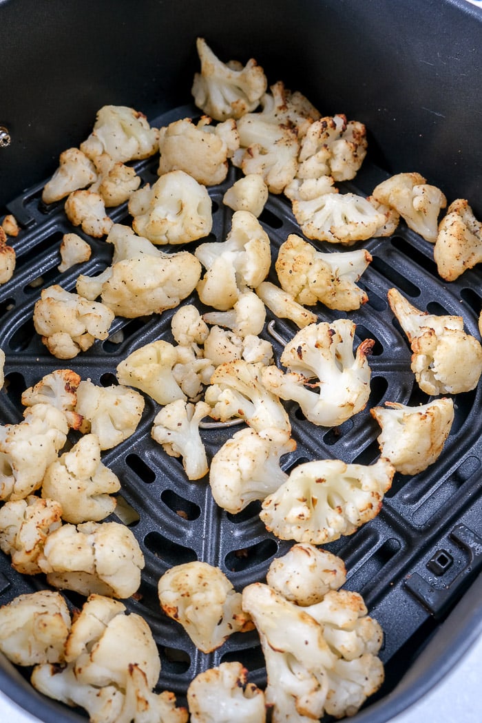 cooked cauliflower from frozen in black air fryer tray