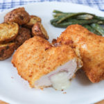 chicken cordon bleu cut open on white plate