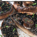 cooked portobello mushrooms on white plate with text overlay 