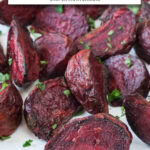 cooked beets with parsley on white plate with text overlay 