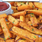 butternut squash fries on plate with ketchup and text overlay "butternut squash fries in the air fryer".
