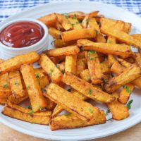 squash fries on plate with ketchup dipping sauce beside
