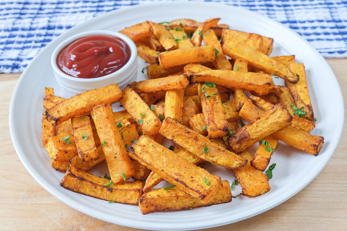 squash fries on plate with ketchup dipping sauce beside