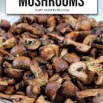 Cooked mushroom pieces in grey bowl with chopped parsley on top and text overlay saying "air fryer mushrooms"
