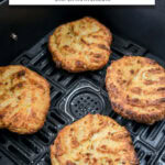 cooked spaghetti squash fritters in black air fryer with text overlay "spaghetti squash fritters in the air fryer".