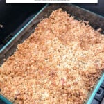 small baking dish with apple crisp in black air fryer with text overlay "apple crisp in the air fryer".