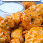 buffalo cauliflower in blue bowl with dipping sauce in background and text overlay "buffalo cauliflower in the air fryer".
