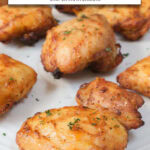 cooked chicken thighs on plate with chopped parsley on top and text overlay "chicken thighs in the air fryer".