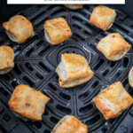small sausage rolls in black air fryer with text overlay "frozen sausage rolls in the air fryer".