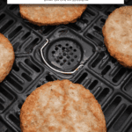 cooked sausage patties in black air fryer with text overlay "frozen sausage patties in the air fryer".