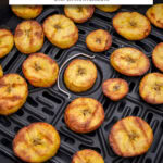 crispy plantain chips in black air fryer with text overlay "plantain chips in the air fryer".
