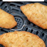 breaded fish fillets in air fryer basket with text overlay "frozen breaded fish in the air fryer".