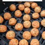 small turkey meatballs in black air fryer with text overlay "frozen turkey meatballs in the air fryer".