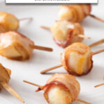 scallops wrapped in bacon on white plate with text overlay "frozen scallops with bacon in the air fryer".