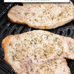 unbreaded pork chops in black air fryer basket with text overlay "pork chops in the air fryer".