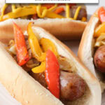 brats and peppers on buns with text overlay "brats & peppers in the air fryer".