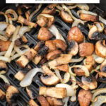 cooked mushrooms and onions in air fryer with text overlay "mushrooms & onions in the air fryer".
