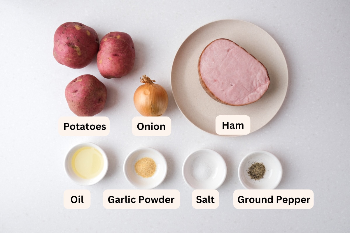 ingredients to make ham and potatoes in bowls on counter with labels.