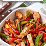 cooked chicken fajitas in bowl with text overlay 