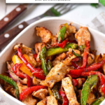 cooked chicken fajitas in bowl with text overlay "air fryer chicken fajitas".