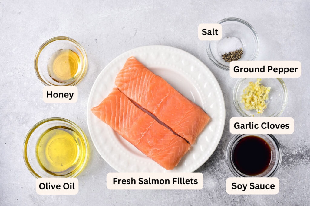 ingredients to make salmon like fillets and spices in bowls on counter with labels.