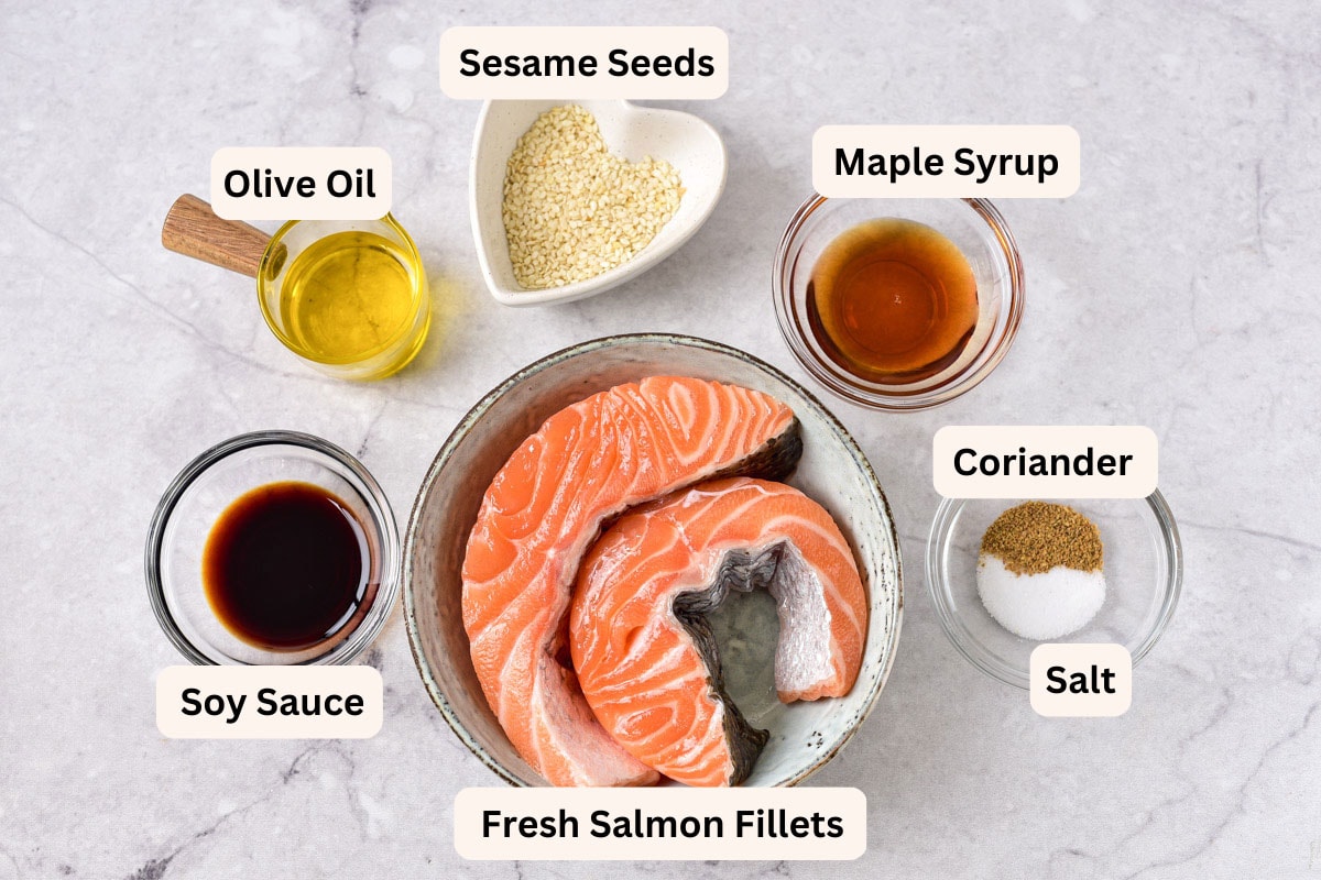 ingredients to make salmon bites in clear bowls on counter seen from above with labels.