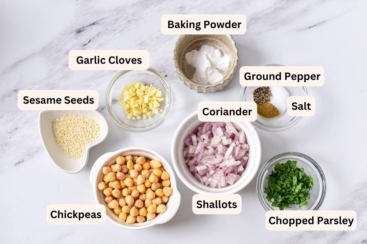 ingredients in bowls with labels on counter to make falafel balls.