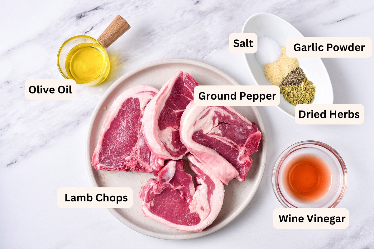 ingredients to make lamb chops in the air fryer on plates on counter with labels.