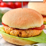 salmon burger on bun with lettuce and tomato plus text overlay "salmon burgers in the air fryer".