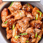 cooked teriyaki chicken garnished with sesame seeds in bowl with text overlay "teriyaki chicken in the air fryer".